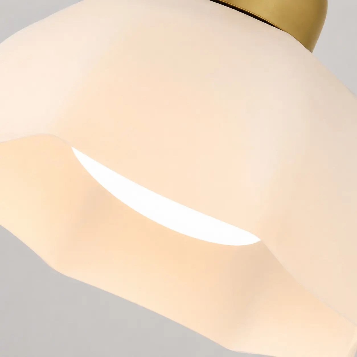 Close-up of a sculpted white glass lampshade