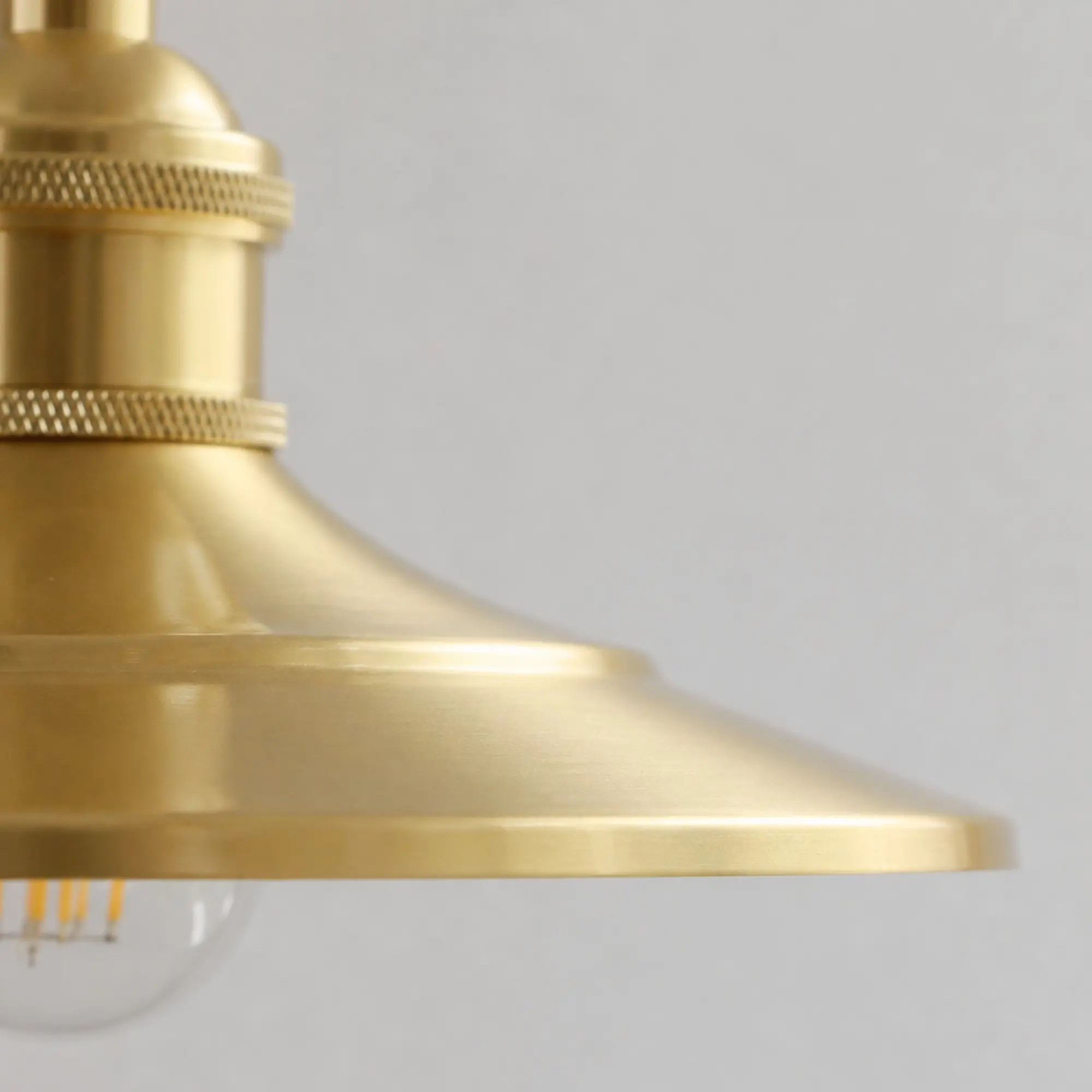 Close-up of smooth polished brass shade edge