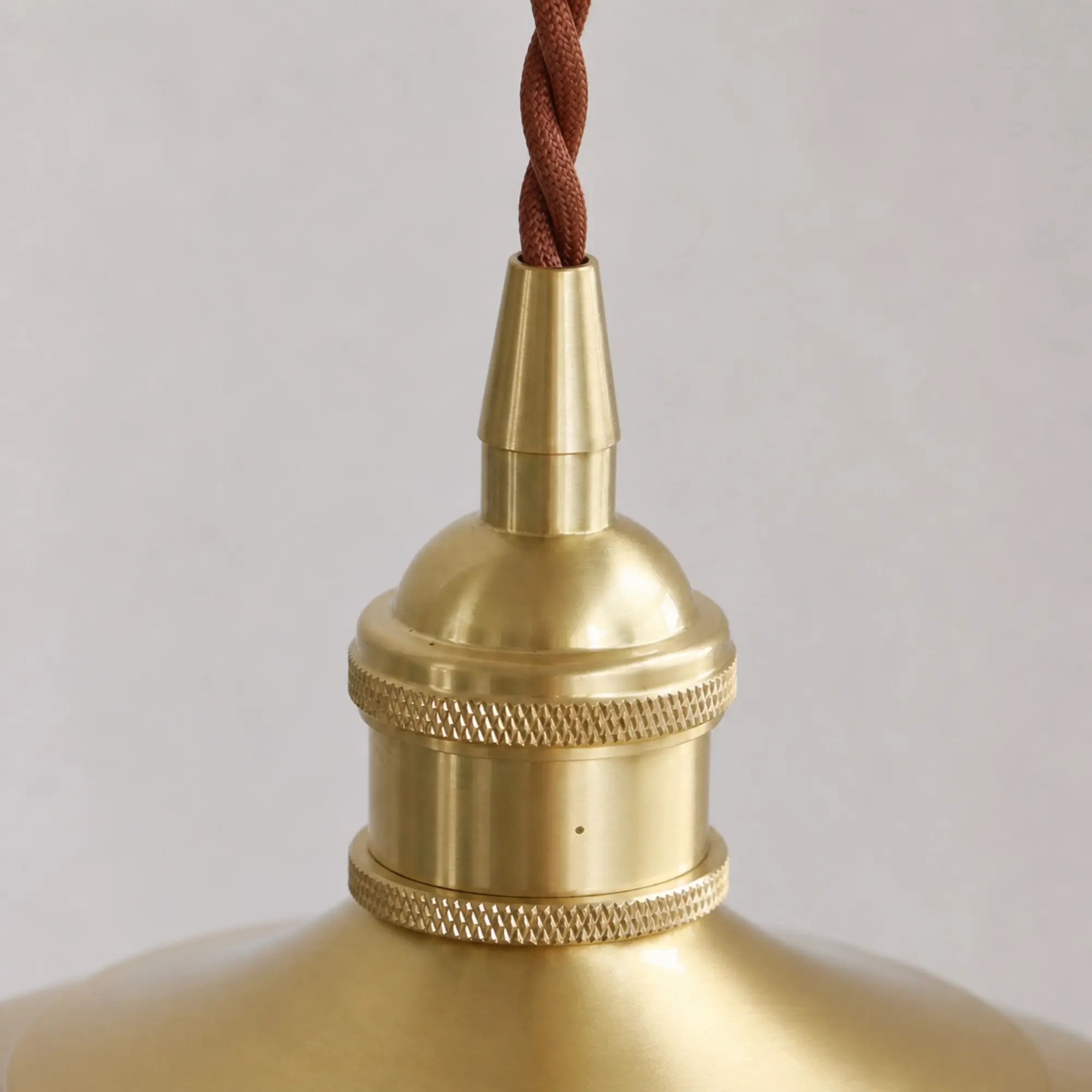 Close-up of braided cord and brass cord grip